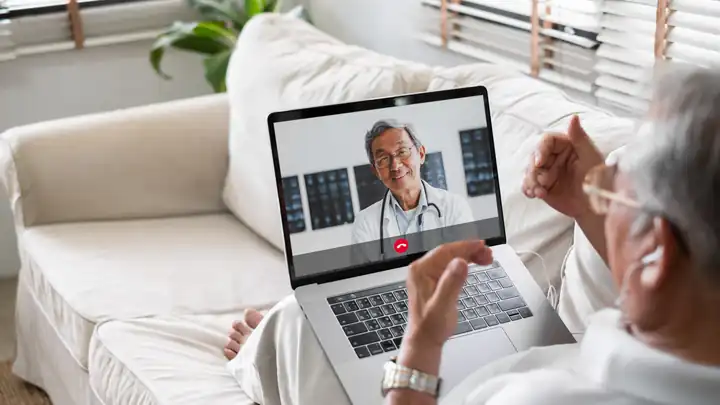 Clinician on a laptop video call reviewing a PSD letter request
