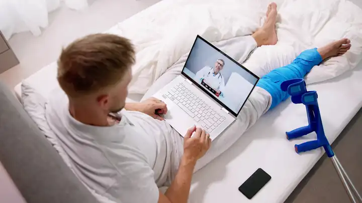 Man on a laptop video call checking a PSD letter